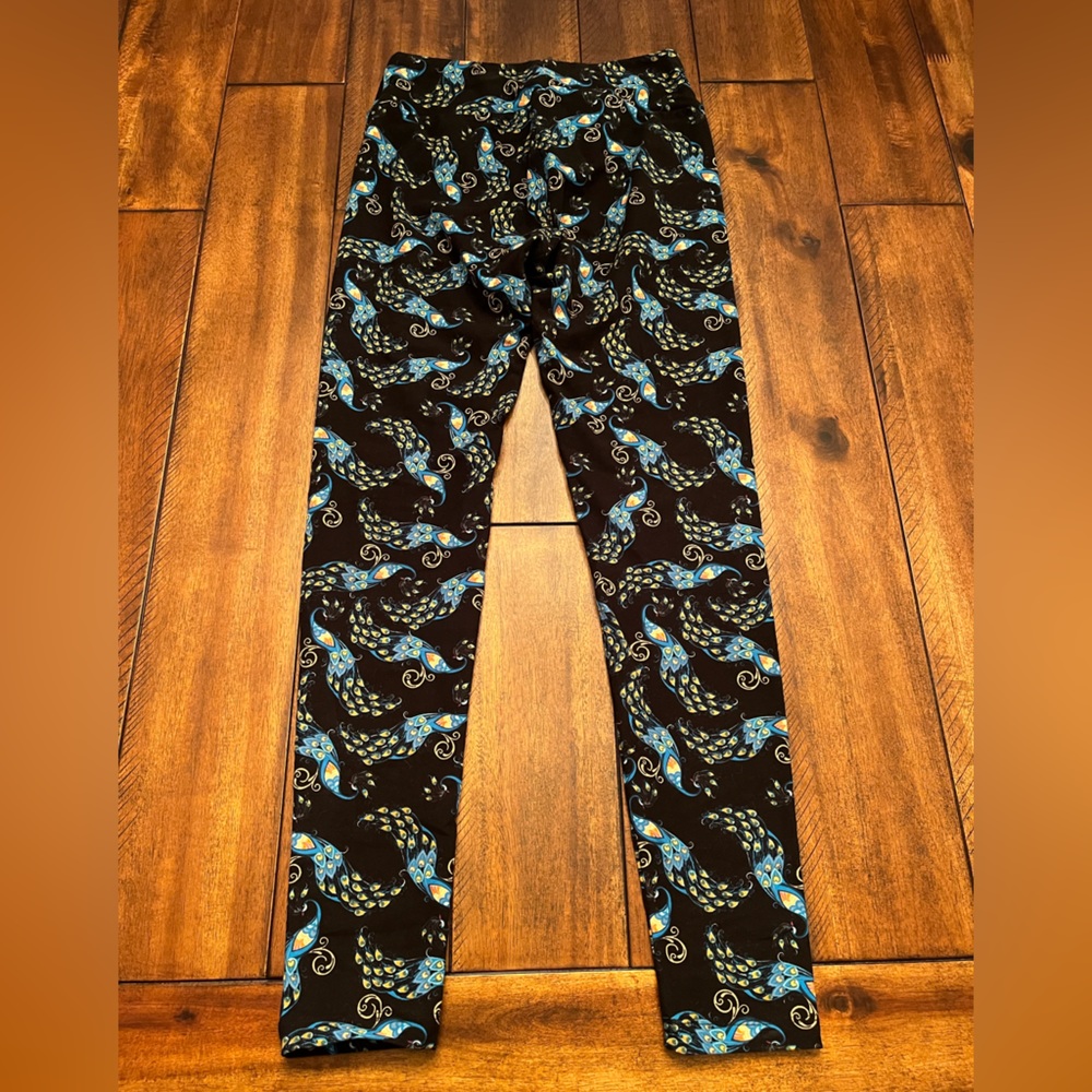 Lularoe Leggings “one size”.  Lightly used. Black with blue peacock feathers.